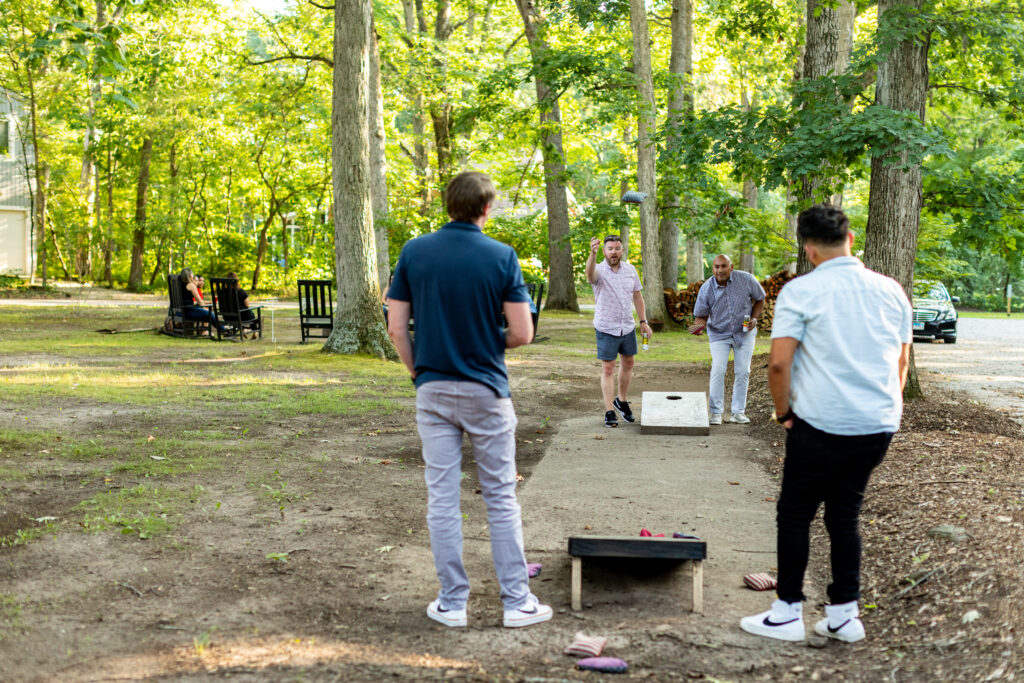 Corn hole and backyard hangs at the Neighborhood Hotel in Grand Beach, Michigan.